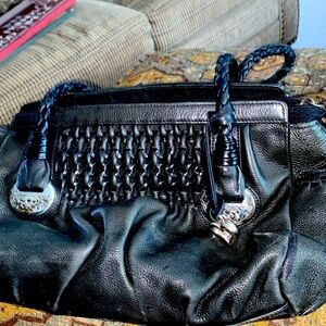 Brighton black pebble leather handbag with braided or woven handles.